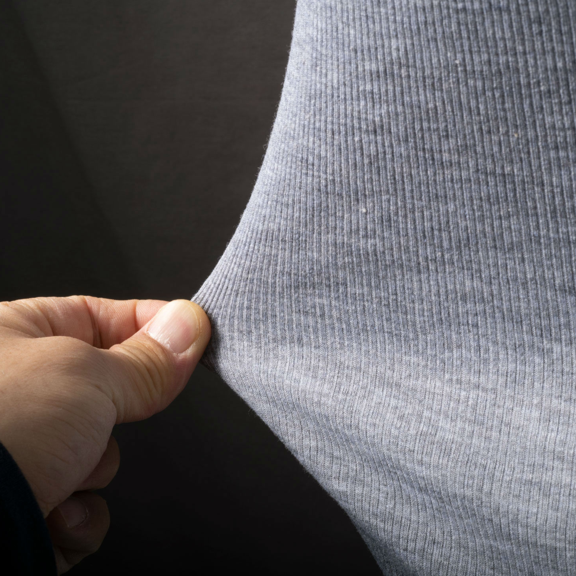 Rich Cotton gray ribbed fabric close-up showing durable stretch cotton texture.