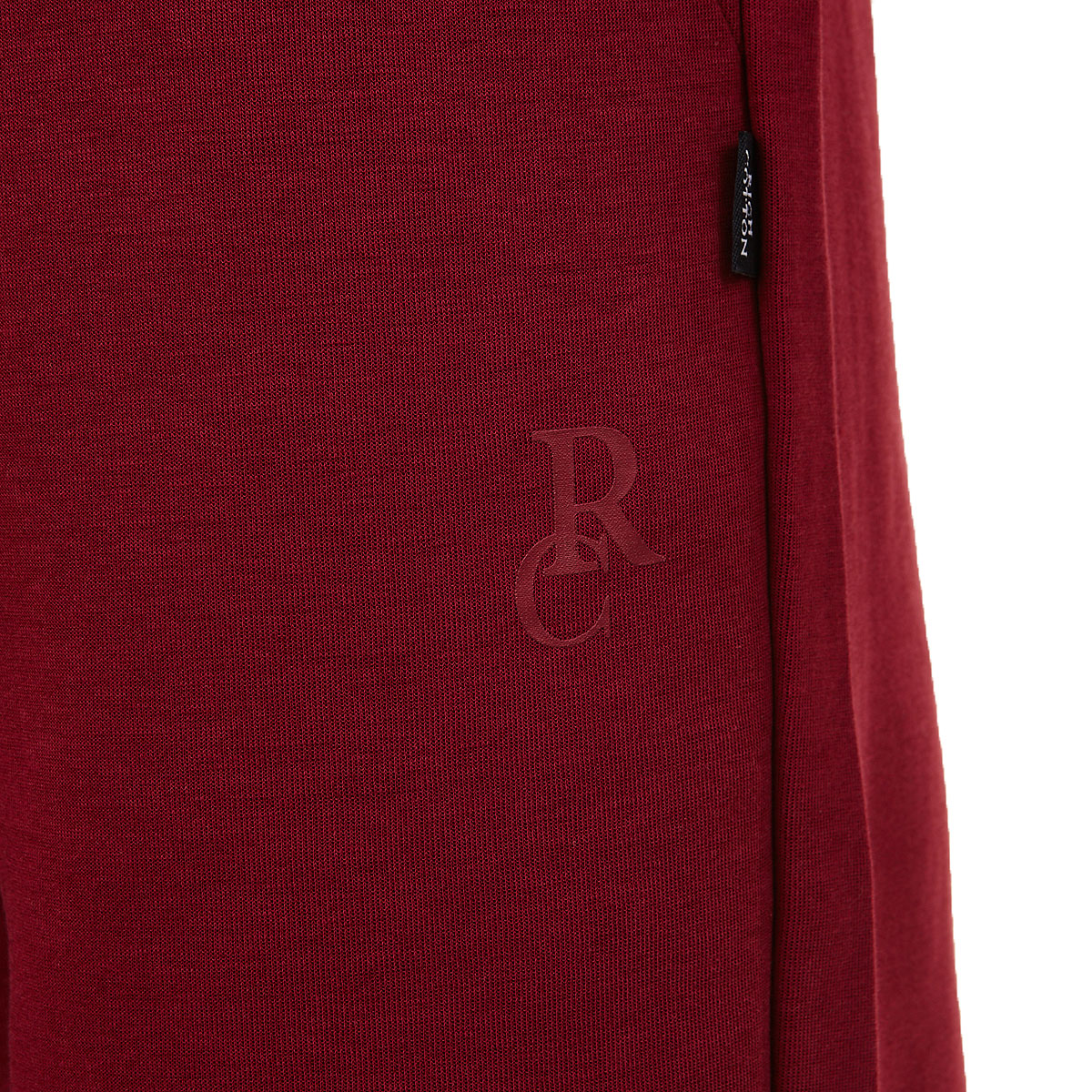 Bold red shorts made with 55% cotton, 45% polyester.