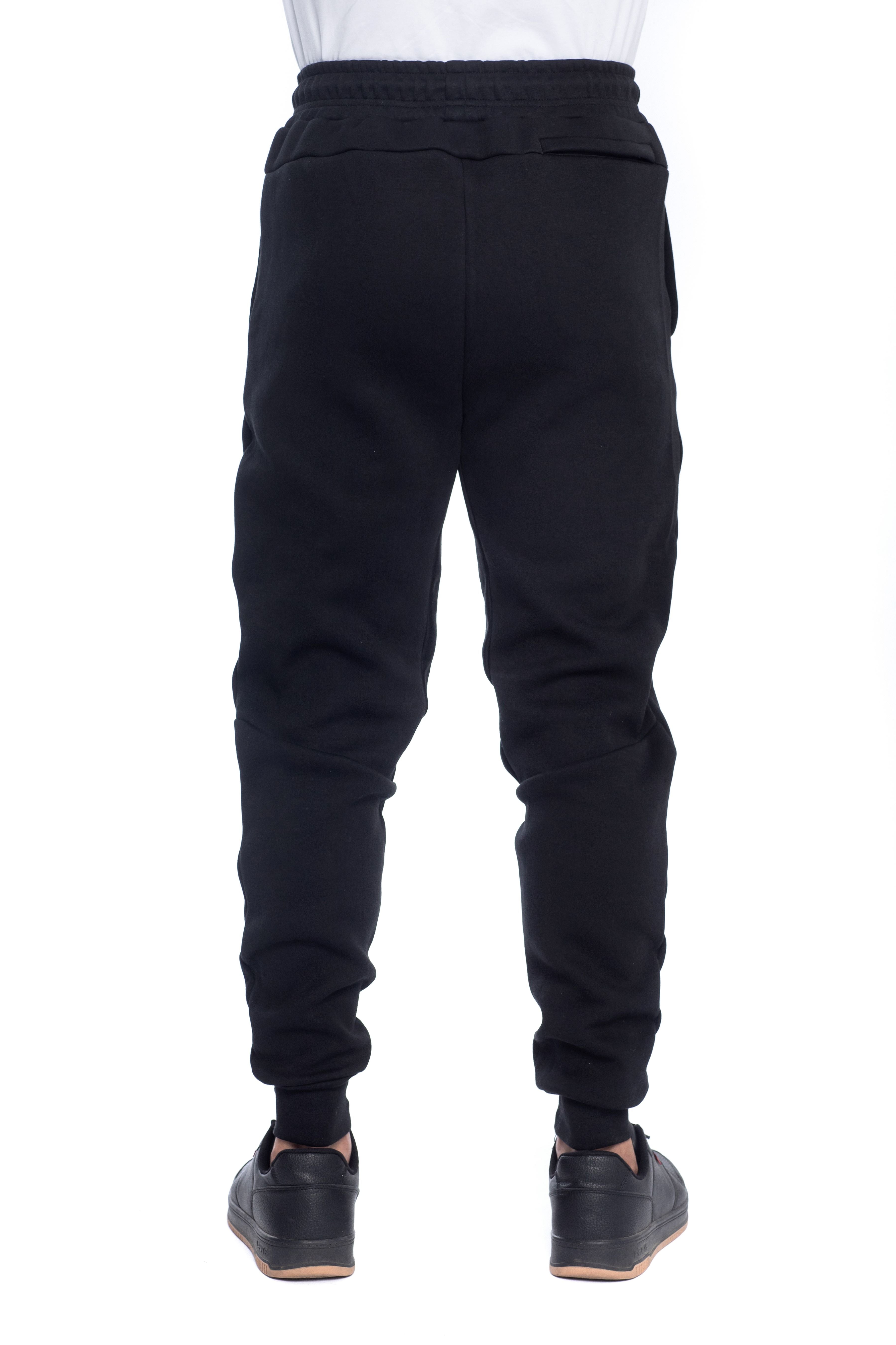 Back view of men�fs black jogger sweatpants with elastic waistband, slim tapered fit, and single back pocket